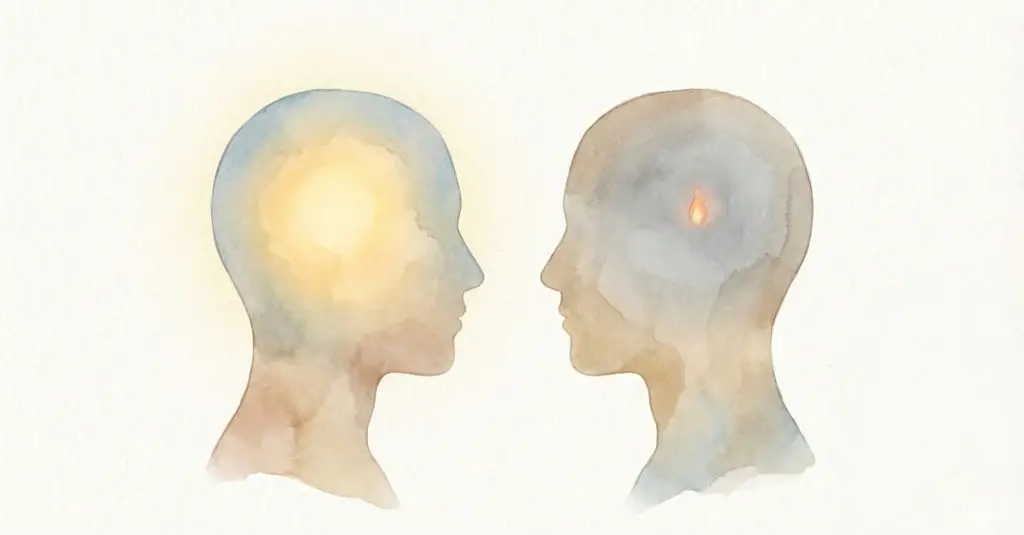 Illustration aquarelle de deux têtes de profil, symbolisant la perte d'énergie mentale et émotionnelle dans le burn-out parental. L'une a une lumière vive, l'autre une faible flamme.